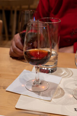 Professional tasting of different fortified dessert ruby, tawny port wines in glasses in porto cellars in Vila Nova de Gaia, Portugal