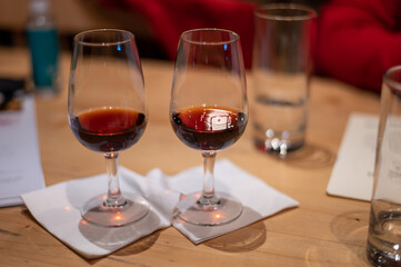 Professional tasting of different fortified dessert ruby, tawny port wines in glasses in porto cellars in Vila Nova de Gaia, Portugal
