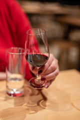 Professional tasting of different fortified dessert ruby, tawny port wines in glasses in porto cellars in Vila Nova de Gaia, Portugal