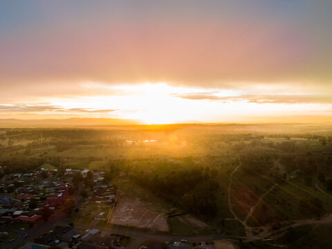 Edge of housing development area and paddocks at sunset