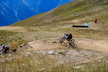 Foto op Aluminium Extreem outdoor sport challenge in French Alps mountains in summer, riding downhill on sport bike on special bicycle path © barmalini