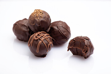 variety of handmade gourmet chocolate truffle candy isolated on white background