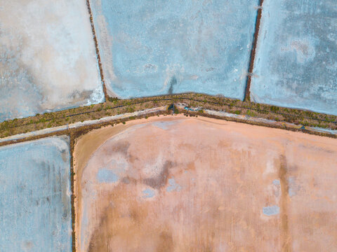 Aerial view of salt evaporation ponds of various shapes