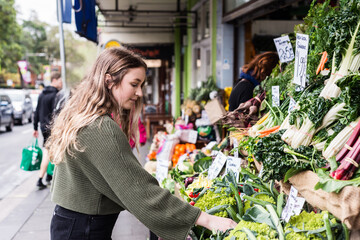 young woman shopping at greengrocer