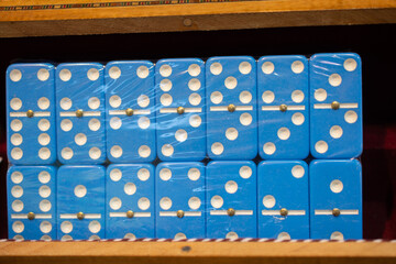 Closeup of blue domino pieces packaged in transparent plastic in the store