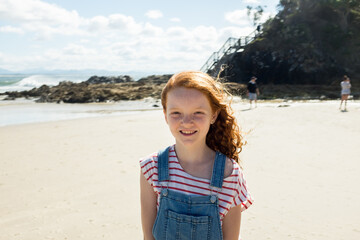 Portrait of a young girl smiling at the beach