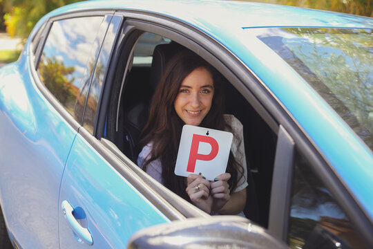 Teenage Girl Holding P Plate