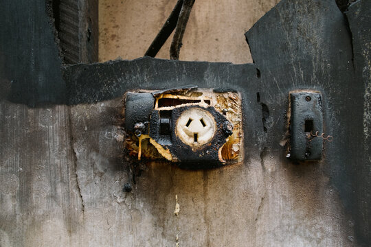 Remains Of Burnt Out Electrical Plug In A Burnt Home