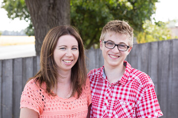 Close up of mother and teenage son smiling