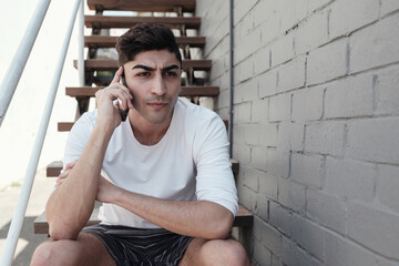 multicultural young adult man on the phone