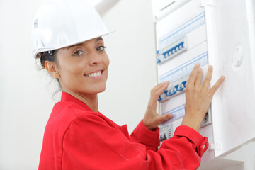 a woman measuring electrical current