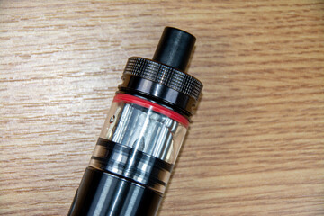 a black electronic cigarette with vapors