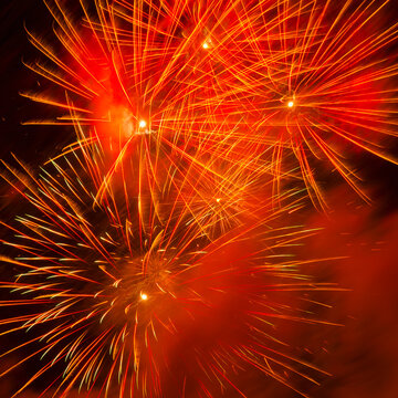 Fireworks explosion against night sky