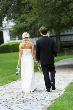 Newly wed couple walking together