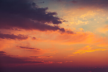 Naklejka na ściany i meble Beautiful colorful dramatic sky with clouds at sunset