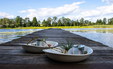 Two plates of sea food dish on a dock.