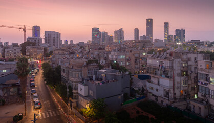 Tel Aviv contrasts: poor quarters and modern skyscrapers at sunset