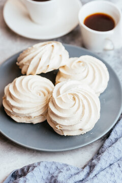 A variety of sweet homemade desserts on a light marble backgroun