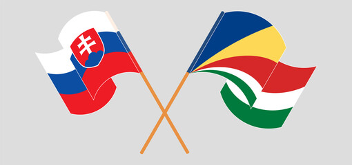 Crossed and waving flags of Slovakia and Seychelles