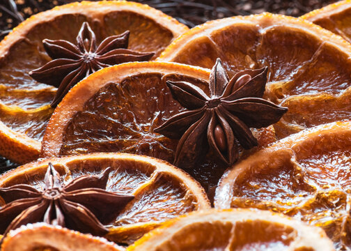 Christmas backdrop, traditional caramelised orange slicers with spice - Powered by Adobe