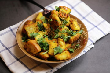 A bowl of homemade freshly prepared Bread Upma, a savory and spicy South Indian bread dish