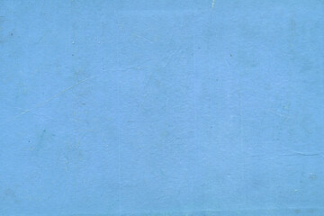 Cardboard blue abstract pattern texture close-up. Retro old paper background. Grunge concrete wall. Vintage blank wallpaper.