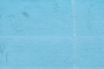 Cardboard blue abstract pattern texture close-up. Retro old paper background. Grunge concrete wall. Vintage blank wallpaper.