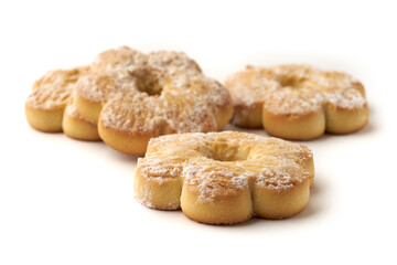 Several cookies covered with powdered sugar isolated on white background