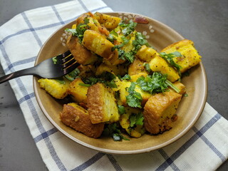 A bowl of homemade freshly prepared Bread Upma, a savory and spicy South Indian bread dish