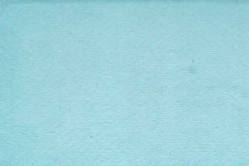 Cardboard blue abstract pattern texture close-up. Retro old paper background. Grunge concrete wall. Vintage blank wallpaper.