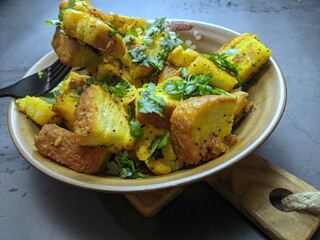 A bowl of homemade freshly prepared Bread Upma, a savory and spicy South Indian bread dish