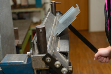 Craftsmen Worked With Sheet Metal Bending Machine