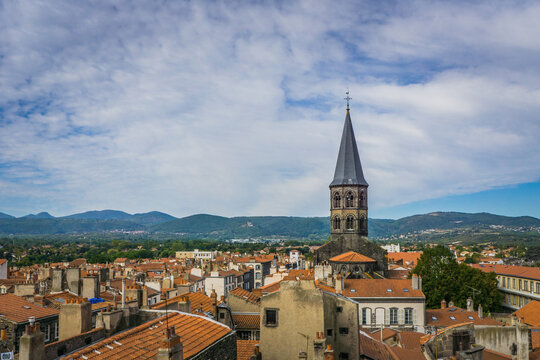 View from the top of the belfry on the Saint Amable basilica bell tower  and the roofs of the small town of Riom in Auvergne (France) 