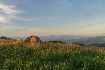 Brown tent on Max Patch bald at sunset