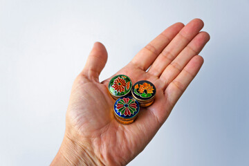 Traditional Indian perfumes in paste in hand. Small souvenirs