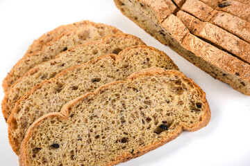 Sliced ketogenic bread made of oatmeal and coconut flour on a white background