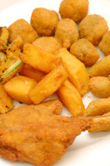 Mixed fried all'ascolana fritto all'ascolana includes olives all'ascolana, artichokes, courgettes, lamb cutlets and fried cream.