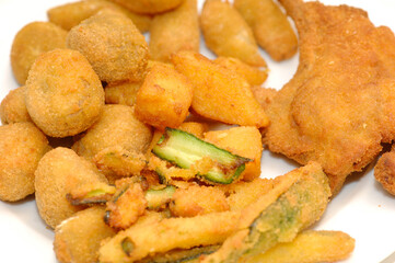 Mixed fried all'ascolana fritto all'ascolana includes olives all'ascolana, artichokes, courgettes, lamb cutlets and fried cream.