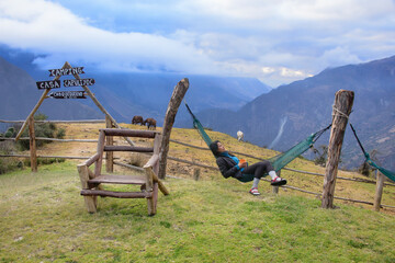 A tourist relaxing in a hammock after the tough Choquequirao trek, the "other Machu Picchu," Capuliyoc, Apurimac, Peru