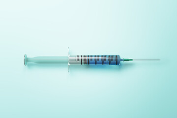 Syringe with injection on blue background.