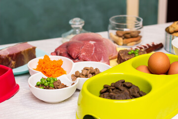 Preparing natural organic food for pets at home. Raw ingredients for pet food in bowl