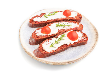 Red beet bread sandwiches with cream cheese and tomatoes isolated on white background. Side view.
