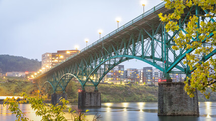 Green Steel Arch bridge during twilight
