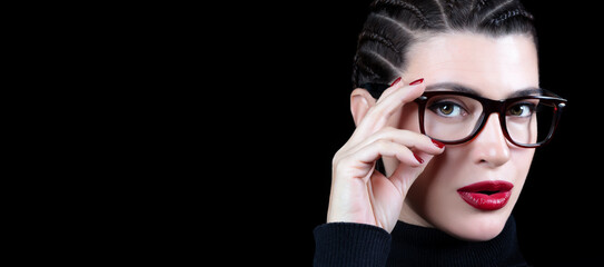 Beautiful woman with braided hair wearing glasses. vision care, optometry and fashion eye wear