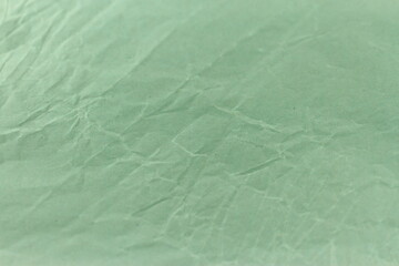 Green crumpled paper,  olive pattern grunge texture, blank sheet wallpaper 