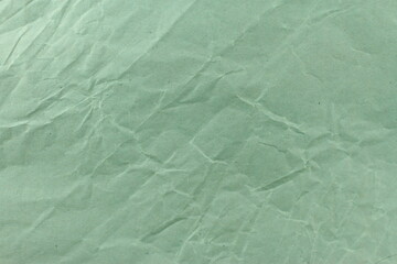 Green crumpled paper,  olive pattern grunge texture, blank sheet wallpaper 