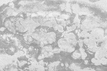 Old dirty gray and white concrete wall with abstract cement pattern texture background.