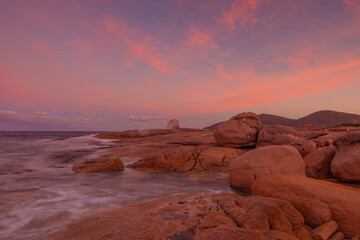 Fototapeta na wymiar Beautiful winter's sunset over Bicheno's blowhole. East Coast of Tasmania, Australia.