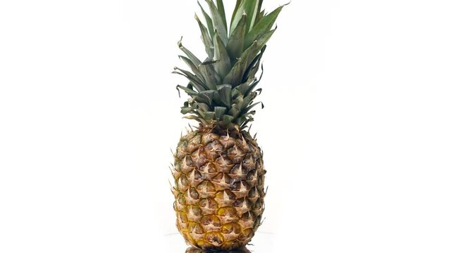 Pineapple rotating on a white background.
