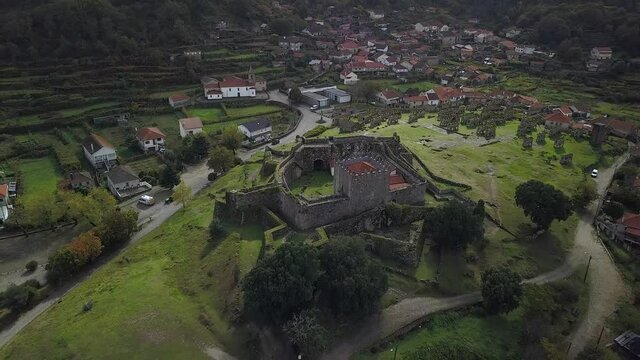 An aerial view of the Castelo de Lindoso, Portugal, with "Espigueiros" in 4K